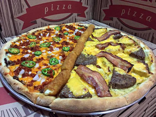 tastefullyoffensive:  The Trump Pizza (wall included) from Casera Pizza in Mérida, Mexico.