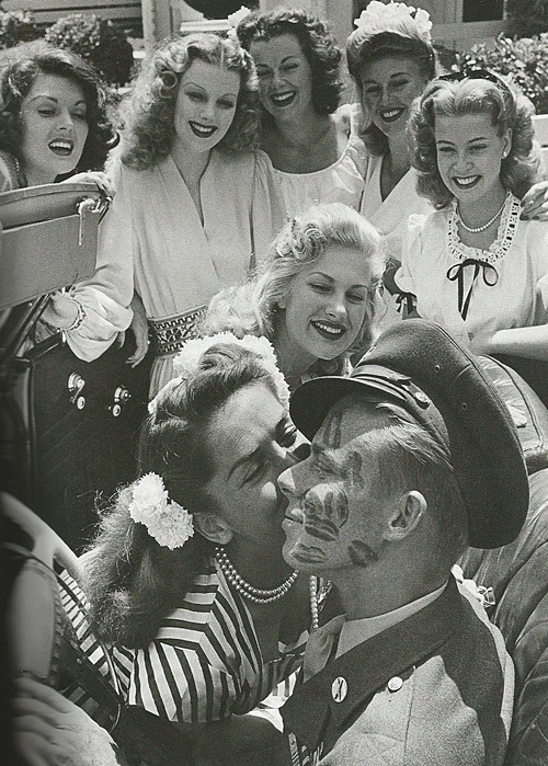 oldhollywood-glamour: Pvt. John Farnsworth covered in kisses by famous pinups and actresses (L to R 
