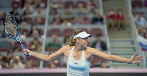 Maria Sharapova defeats Anastasija Sevastova 7-6, 5-7, 7-6 in the first round of the China Open.