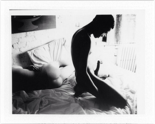 ouijno:  Two young men in bed, expired Polaroid film. 