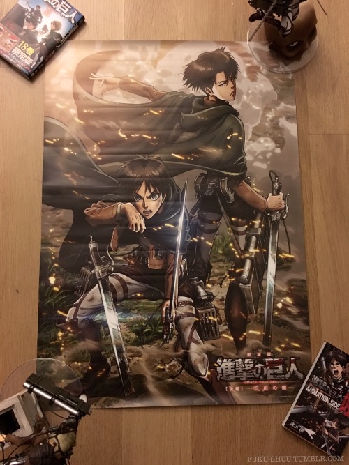 Also arrived today: the Eren + Levi bonus poster awarded to early ticket buyers of the 2nd Shingeki no Kyojin compilation film, Shingeki no Kyojin Zenpen: ~Jiyuu no Tsubasa~!(Had to hold the corners down temporarily using manga volume 18, Animation Side