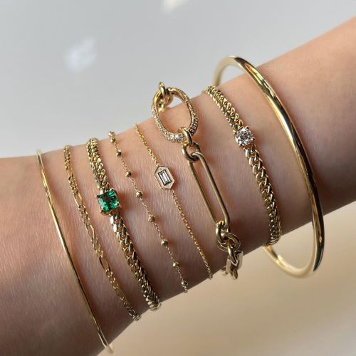 Bracing for summer with this bracelet stack ✨. . #madeinnyc #braceletstack #emeraldbracelet #goldb