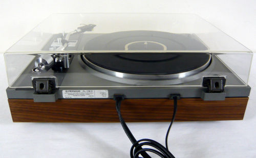 Pioneer PL-115 | Auto Return Belt DriveTurntable. Reconditioned and serviced. Semi automatic. Original vinyl removed and replaced with real wood walnut veneer. Mechanism cleaned and lubricated. The dust cover has been buffed and polished. Sure Hi Track