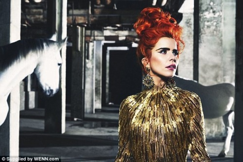 Paloma Faith stuns in metallic gold gown and poses with a large yellow python as she launches new ar