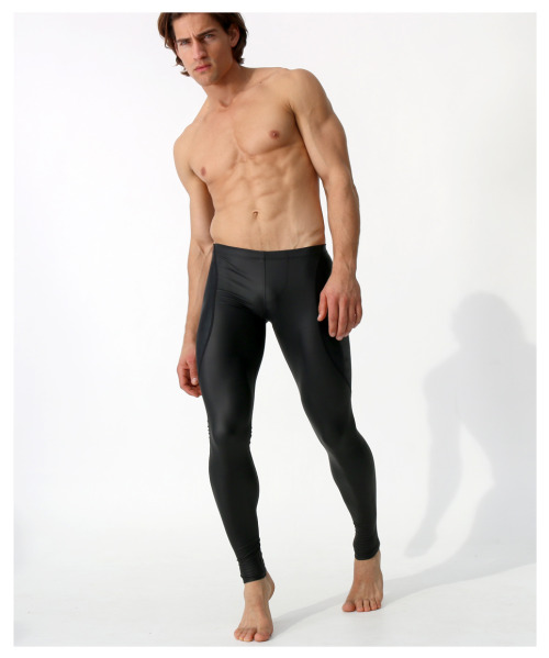 rufskin:  New Style Alert: KANG Performance tights constructed from a flat finish “rubber-look” poly-spandex blend featuring 4-way stretch. Focal point of design: a contrasting yoke panel, composed of stretch nylon-spandex with a shiny finish, swooping