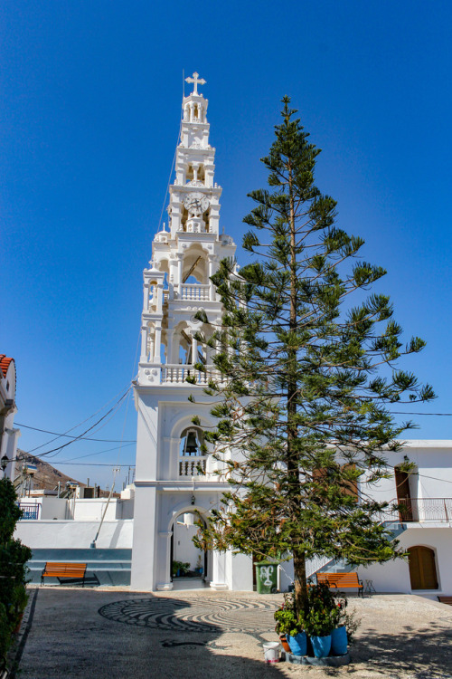 White on green.Bell tower and tree in Asklipio, Rhodes 2011.