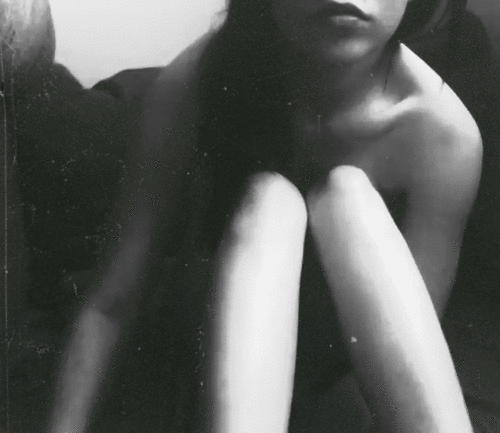 fruitkitty:  Thought this was interesting. She looks like she’s trapped behind glass, curled up, and thin. She looks like my eating disorder, that deep feeling inside of me, personified.