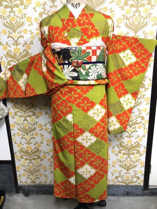 Vibrant vintage outfit seen on. That lively lime+orange kimono features a hanabishi (diamond flowers