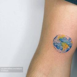 Minimalist one line earth tattoo