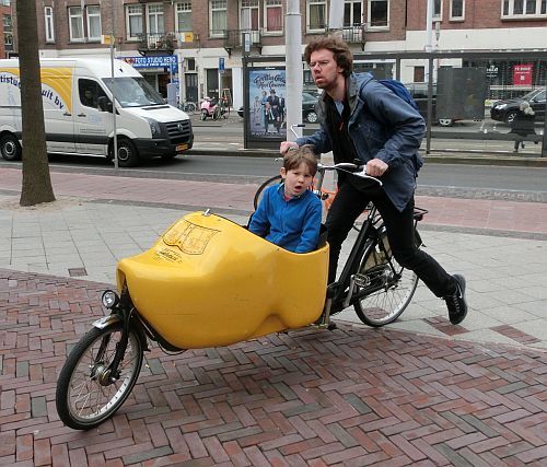 bicycle-amsterdam: Wooden shoe shaped cargo bicycle. Amsterdam Linnaeusstraat.