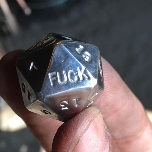 shamethedice: shamethedice: **a metal d20 shows what would be the 1 side, but says FUCK instead** En