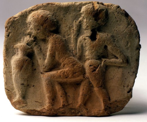 Sexual intercourse between a woman and a man on a terra cotta plaques from Mesopotamia, early 2nd mi