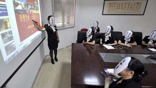 fifidunks:  Chinese workers go ‘faceless’ for a day to avoid stress of faking facial expressions 