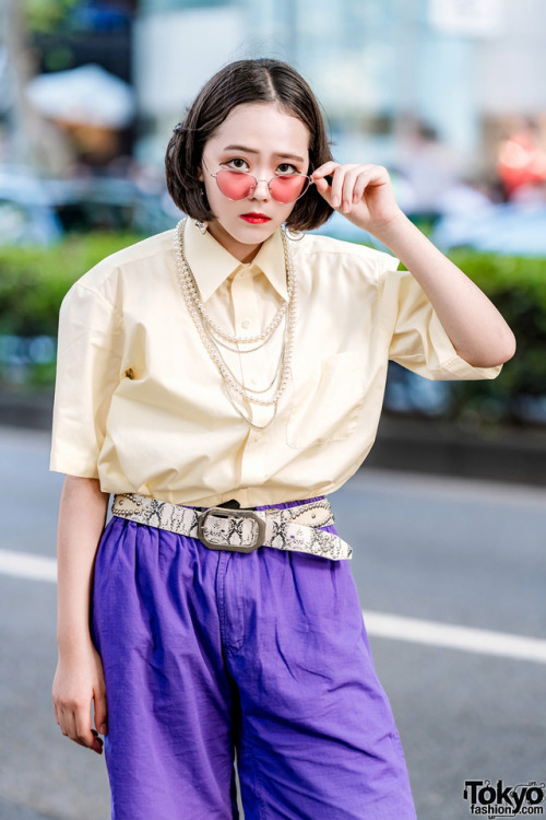 Japanese students 15-year-old Yui and 17-year-old Lisa on the street in Harajuku. Yui is wearing an 