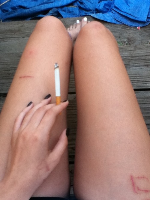 negativetendencies:  Black nail polish, tiny & cut thighs, and 100s makes yourself happy 