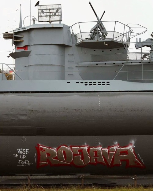 “Rise up for Rojava”Vandalized submarine monument in Kiel, Germany