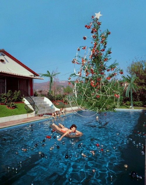 A Christmas Swim, 1955Photographer Slim Aarons took this picture of his wife Rita enjoying a swim am