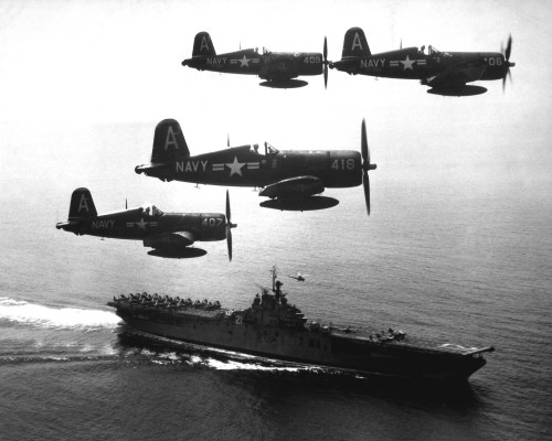 Corsairs returning from a combat mission over North Korea circle the USS Boxer (CV-21) as they wait 