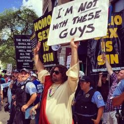 ceehu:  jamesmdavisson:  Yesterday at Pride in Chicago.  the cop smiling at him though haha 