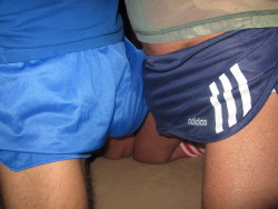 underwearsex:  two friends play wearing shiny shorts Ricardo Fabbro &amp; Marc ! http://www.facebook.com/ricardo.fabbro.5 