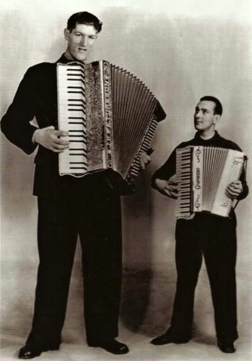 Johann Petursson - 7 feet 7 inches (231.14 cm) Copenhagen, 1937. The accordeon was specially made for Johann and can now be viewed in the Natural History museum in Dalvik.