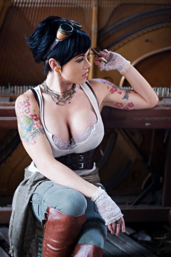 swoop-cypry:Sexy tattoo babe with her cigar mmmm what a hottie