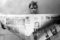 Cockney Tough-Guy Actor Michael Caine Reading A Copy Of The Evening Newsphoto By: