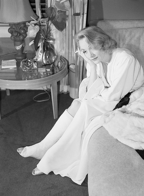 misstanwyck: Marlene Dietrich nurses a broken ankle after tripping on set in September 1941