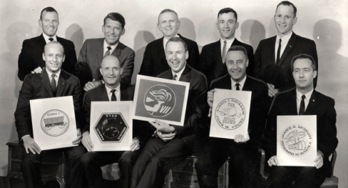gimbal–lock: The crews of Gemini III through VII holding their respective mission’s embl