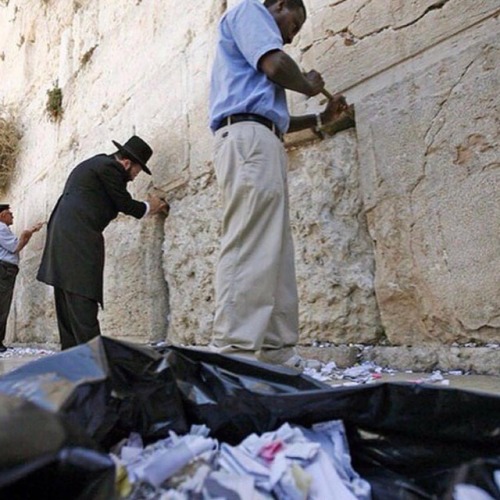 humansofjudaism: PASSOVER CLEANING: The Western Wall Western Wall employees remove millions of handw
