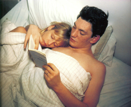 flashofgod:Nan Goldin, Patrick and Teri reading Baudelaire, 1987.