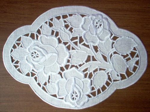 This is a pretty typical example of Richelieu embroidery which is essentially white cutwork.  This e