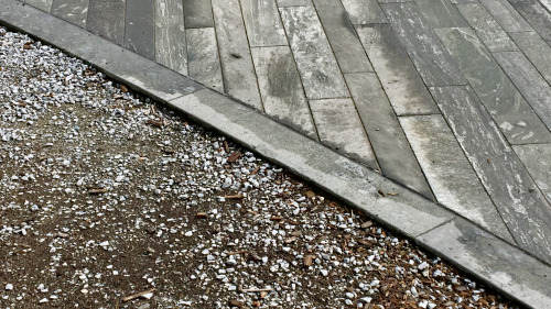 Transition Wooden platform meets ground at Sechseläutenplatz, Zurich.