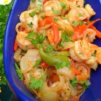 Large shrimp are cooked with ten cloves of garlic in this fragrant dish.