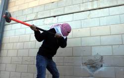 micdotcom:Palestinian youth break through separation wall to remind the world of their own “Berlin Wall” 