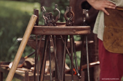 one of my smithy friends working his forge last weekend[image description: four photos of a white ma