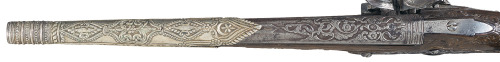 A chisel engraved flintlock pistol with a silver barrel band, originates from Italy, 18th or early 1