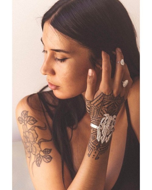 Melina wearing Scarab Bracelet and Baby Petroglyph rings in Sterling Silver. Jewelry handmade in Los