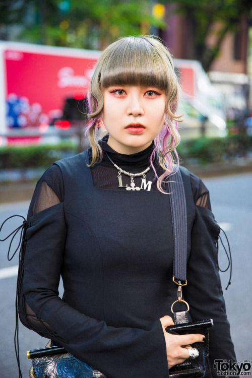20-year-old Japanese fashion student Hazuki on the street in Harajuku wearing a gothic inspired stre
