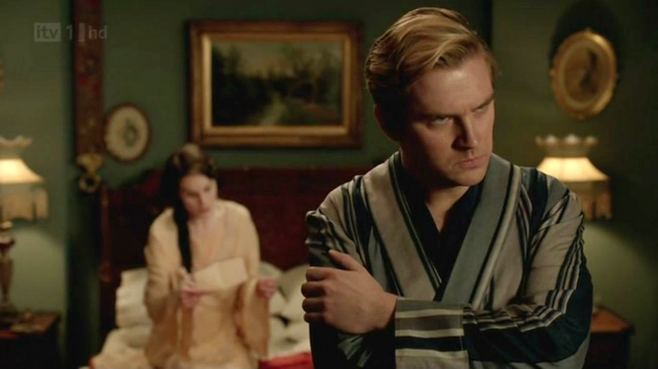Looking constipated in his favorite striped robe as Lady Mary reads a very important letter. I guess the robe is like his security blanket!
There were so many funny faces in this scene, that it was hard picking just one!