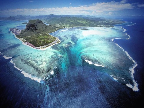 mcqueeny:  beachley:  skeletales:  Approximately 1,200 miles off the southeast coast of Africa lies an island nation known as Mauritius that gives off the illusion of an underwater waterfall at the southwestern tip of the island. The visually deceiving