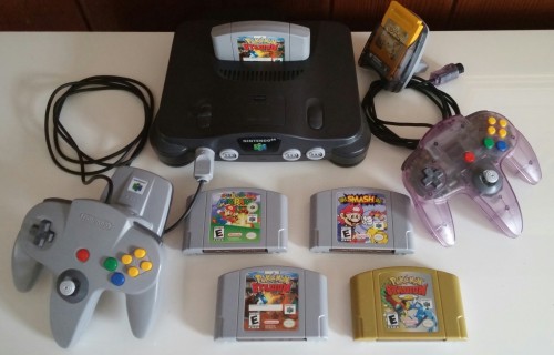 psychms:  Decided to photograph my N64 things today! My cousin gave me his copy of Pokemon Stadium, and I bought a second transfer pack because I was a lonely kid who wanted to trade Pokemon with myself lol.  I missed my 64 and games T ^T