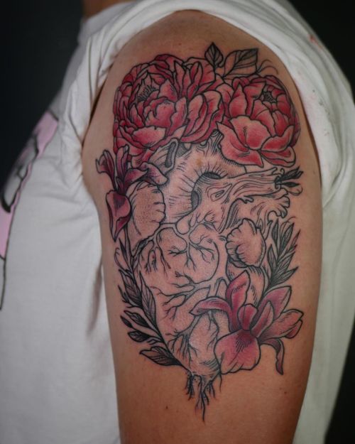 Anatomical heart and florals for Colby! Part one of a blackwork sleeve in progress with red accents.