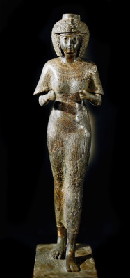 grandegyptianmuseum:      Statue of Karomama Meritmut,     the Divine Adoratrice of Amun   (bronze with gold, silver and electrum, height: 59 cms). Third Intermediate Period, 22nd Dynasty, ca. 850 BC. Now in the Louvre.