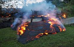 micdotcom:  Surreal photos show lava encroaching on a Hawaiian town  A town in Hawaii has been threatened this week by a slow-moving but thoroughly menacing threat: a river of lava.  Tuesday, the lava flow claimed its first building in the residential