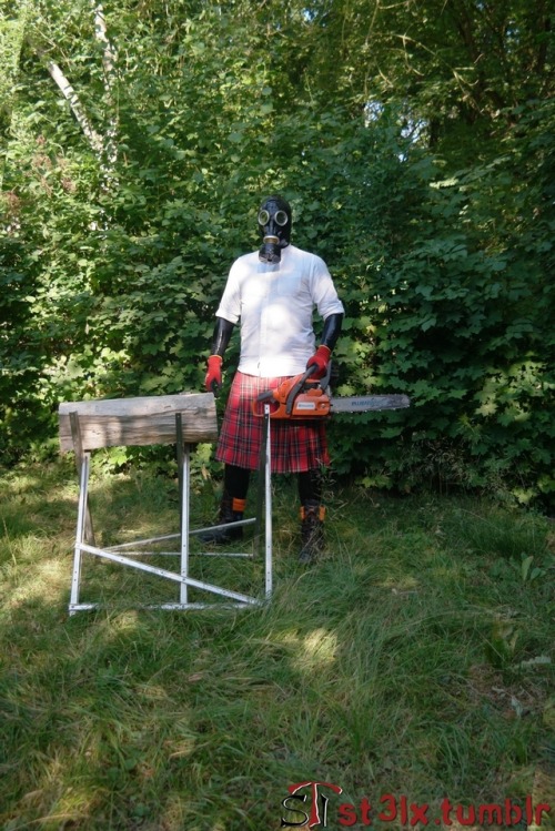 The Rubber Highland Games 2018 - Part 3 of 7Rubbered husband cutting wood in the garden