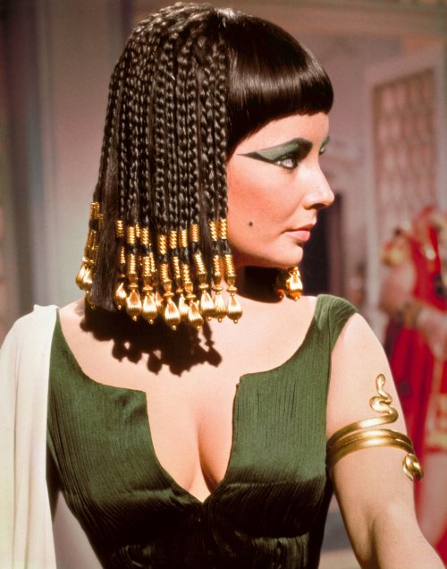 Cleopatra, 1963: Some Many Outfits, So Many WigsI suspect this film is what gave us lots of blue and