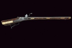 peashooter85:  Ornately engraved and ivory mounted wheel-lock rifle crafted by Guidobaldo Klett of Munich, dated 1702. 