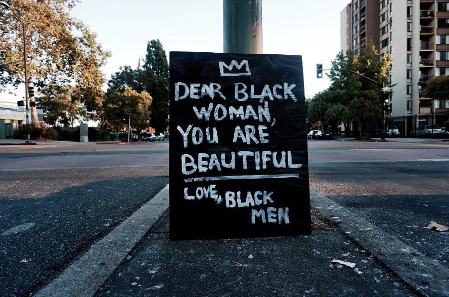 An anonymous person by the name of "Black Man" is putting these signs all