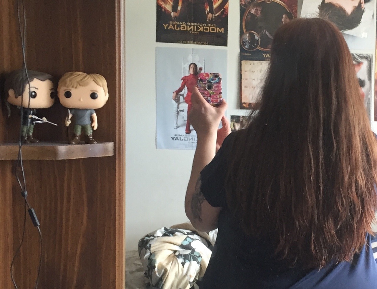 Showing off my hair length (just shy of my waist) and my two new funkos!